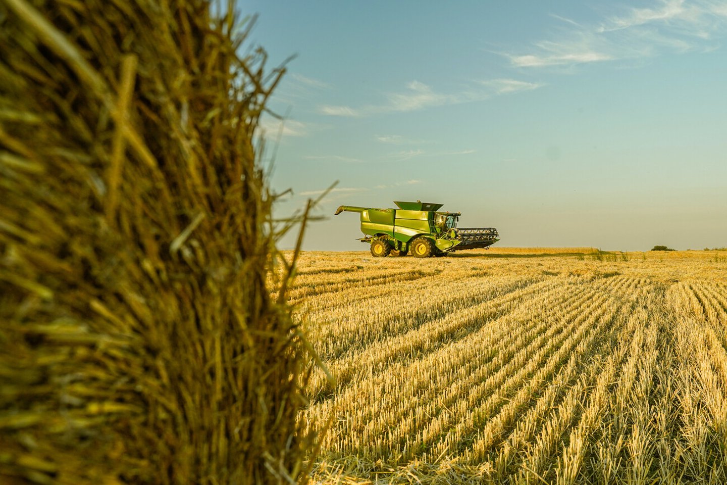 Ternopil, Ukraine - July 9: Modern John Deere combine harvesting grain in the field near the town Ternopil, Western Ukraine July 9, 2021; Shutterstock ID 2023127108