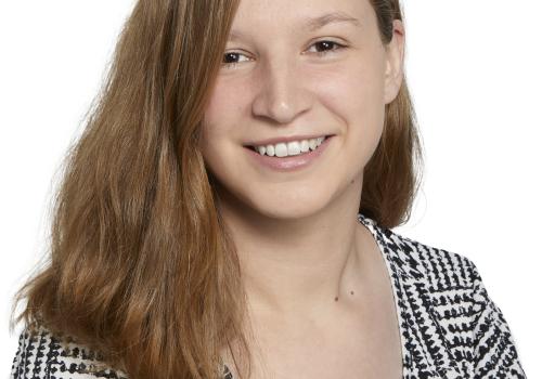a woman smiling and posing for the camera