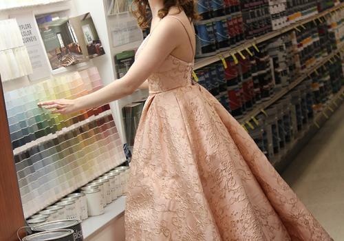 a woman standing in front of a shop