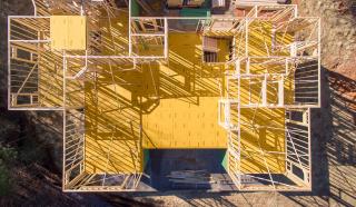 a building with a metal fence