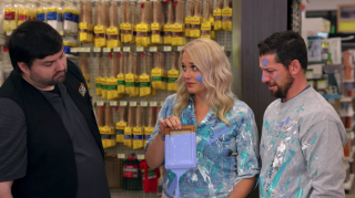 a group of people standing in front of a store