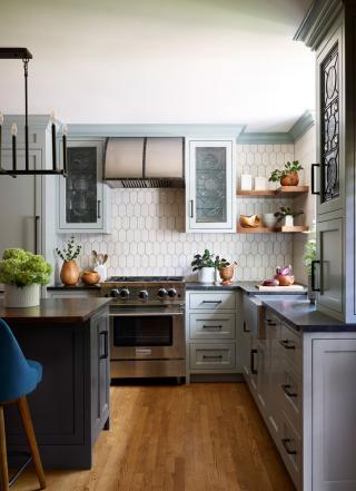 a kitchen with an island in the middle of a room
