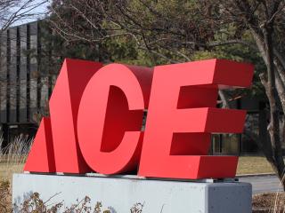 Ace sign a stop sign in front of a building