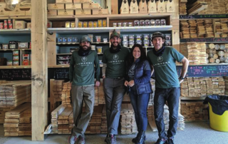 a group of people standing in front of a store