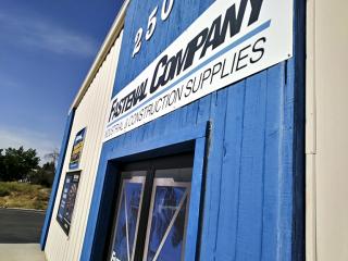 a blue sign in front of a building