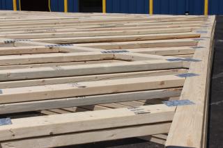 a row of wooden benches sitting on top of a bench