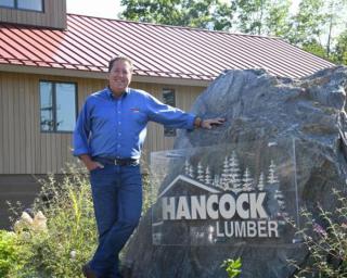 a man standing in front of a building