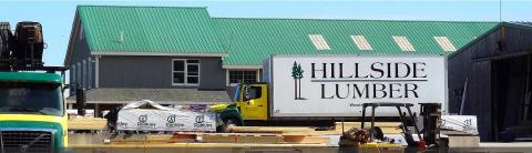a truck is parked in front of a building