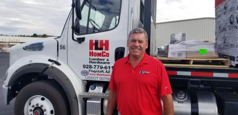 a man standing in front of a truck