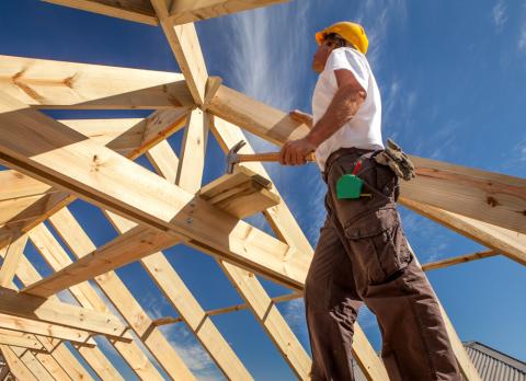 a person standing on top of a wooden ramp