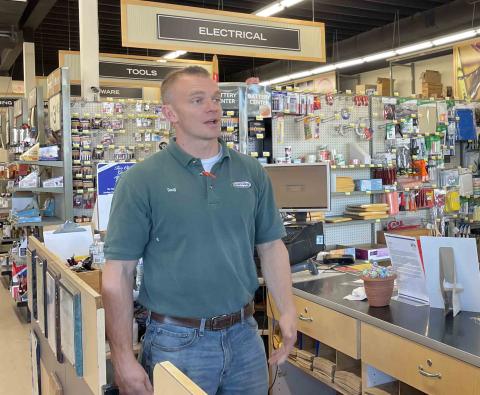 Doug counter a person standing in front of a store