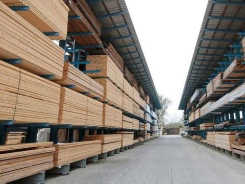 a wooden bench in front of a building