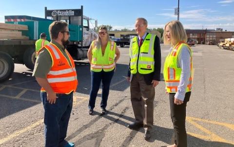 Franklin Building Supply CEO Levi Smith speaks with U.S. Senator Mike Crapo (R-ID) and his wife Susan Crapo.