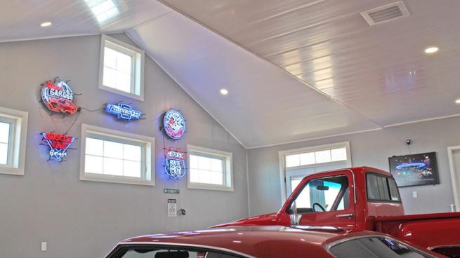 A garage featuring prefinished wall and ceiling panels from Trusscore.