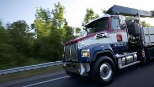 a truck that is driving down the road