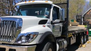 a truck is parked on the side of a road