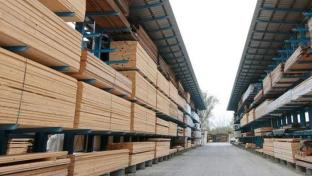 a wooden bench in front of a building